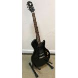 A Gibson Epiphone special model six string electric guitar, four pick ups,
