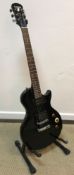 A Gibson Epiphone special model six string electric guitar, four pick ups,