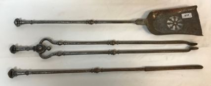 A set of three 19th Century steel fire irons of plain form with octagonal faceted finials to the