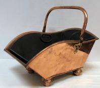 A Victorian copper coal scuttle with swing handle by Henry Loveridge of Wolverhampton circa 1886,