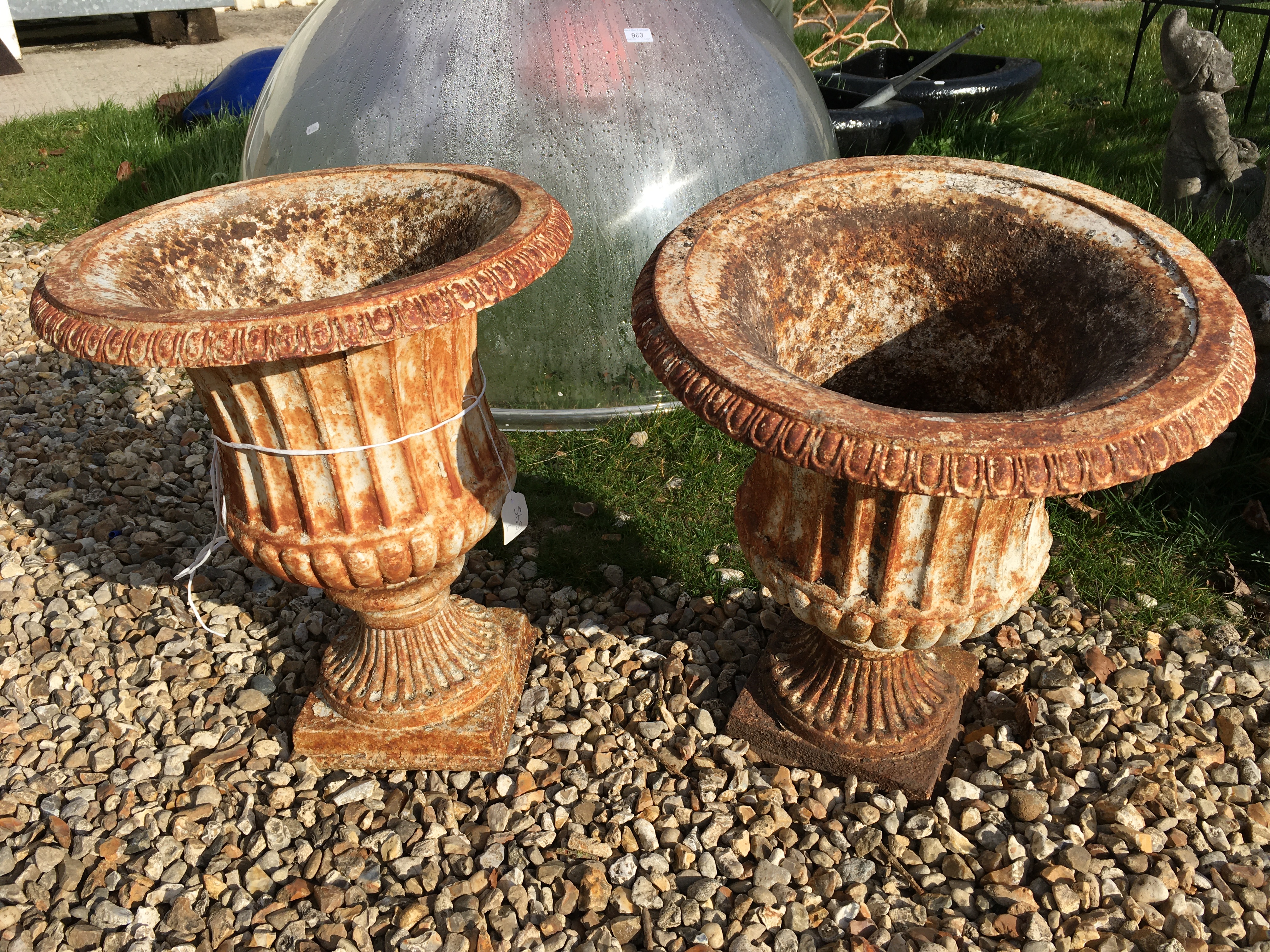 A pair of Victorian painted cast iron garden urns with egg and dart flared rims over fluted and - Image 2 of 3