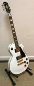 An Epiphone Les Paul custom guitar,