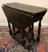 An 18th Century oak oval gate-leg tea table of small proportions, with single end drawer,