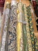 A collection of assorted part rolls / remnant rolls of upholstery fabric,