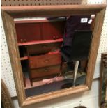 An early 20th Century limed oak moulded framed rectangular wall mirror with plain plate 53.