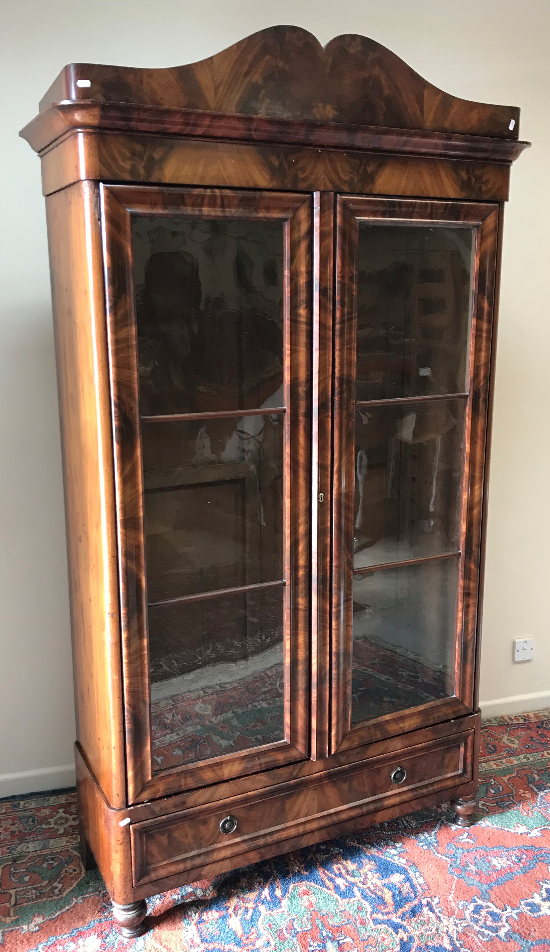 A 19th Century Continental figured mahogany bookcase cabinet,