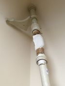 A pair of white painted curtain poles with knob finials and brackets, 233 cm long,