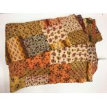 A Neeru Kumar quilted throw in a brown,