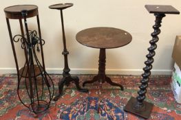 A 19th Century mahogany pedestal occasional table with circular top on a tripod base,