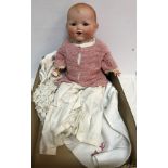An early 20th Century Armand Marseille bisque headed doll "Baby Gloria" with sleep eyes and open