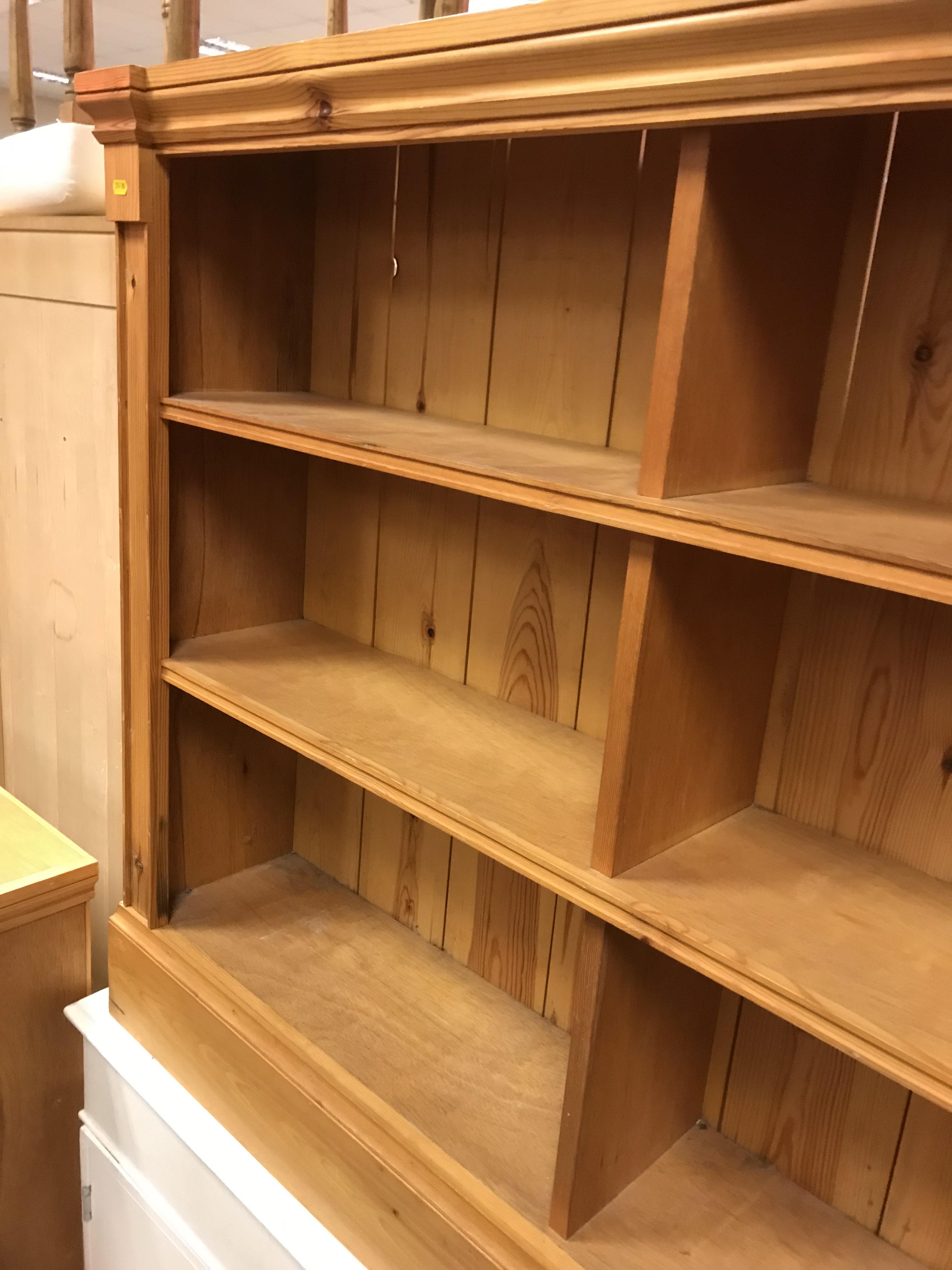 A pair of modern stained pine open bookcases of two banks of three shelves, raised on plinth bases, - Image 5 of 15