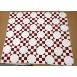 A red and white nine patch / snowball pattern quilt,