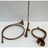 A collection of six 20th Century copper hunting / coaching horns and two French style hunting horns