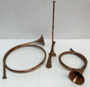 A collection of six 20th Century copper hunting / coaching horns and two French style hunting horns