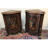 A pair of Continental walnut and marquetry inlaid serpentine fronted corner cupboards,