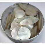 A collection of 132 mother of pearl gaming counters of circular or oval form with crown and