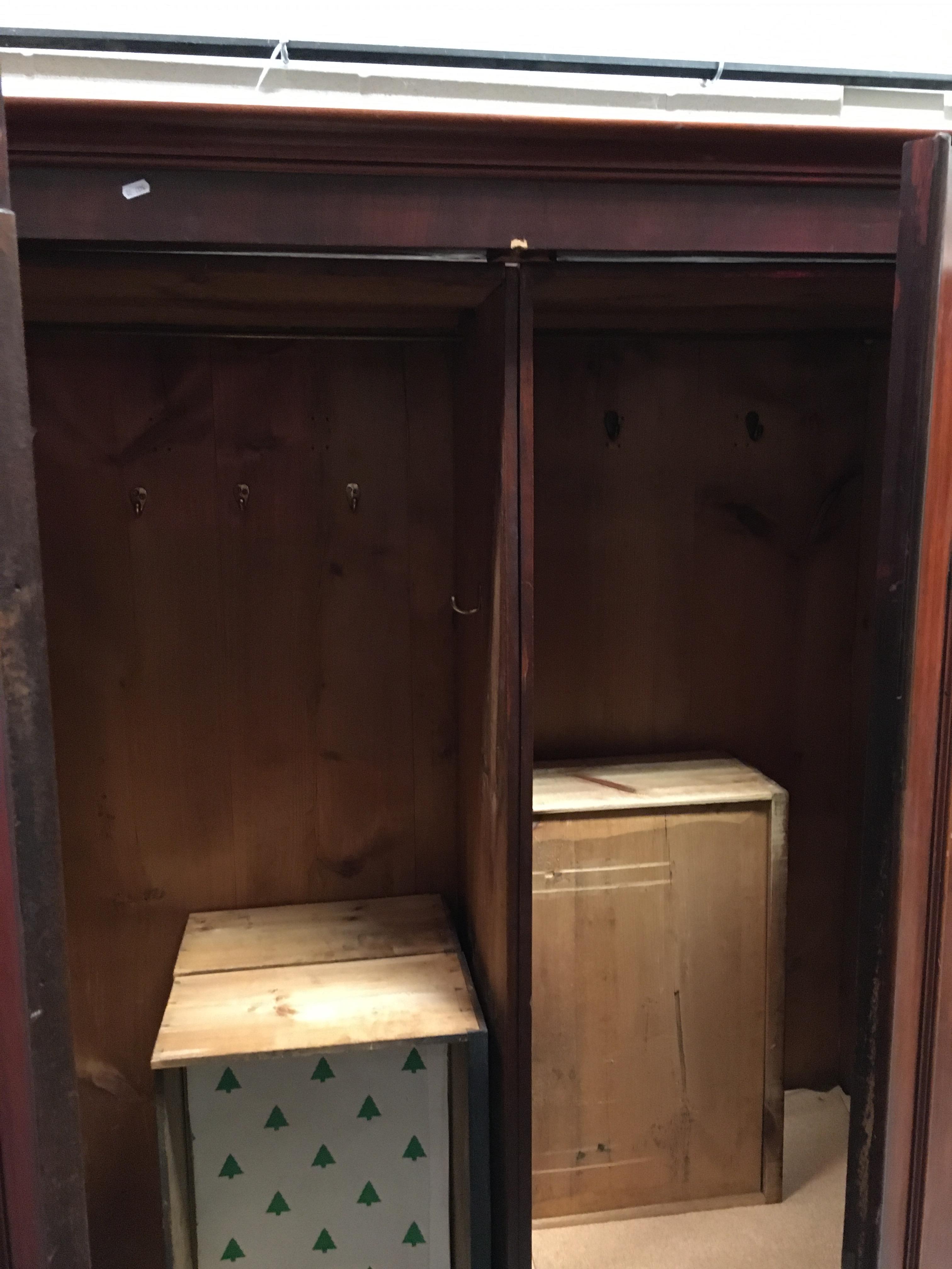 A Victorian mahogany two door wardrobe with hanging space over three drawers on a plinth base 135 - Image 2 of 2