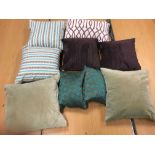 Two bags of assorted scatter cushions in purple,