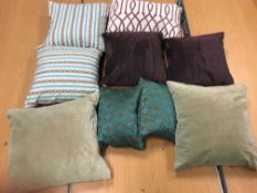 Two bags of assorted scatter cushions in purple,