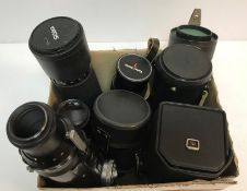 A collection of seven various larger lenses including a Tair 3-PHS 4.
