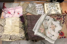 A box of assorted ethnic textiles to include sari remnant, Indian, Chinese, Pakistan,