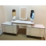 A mid 20th Century melamine veneered two piece bedroom suite of dressing table and two door