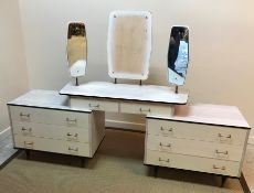 A mid 20th Century melamine veneered two piece bedroom suite of dressing table and two door