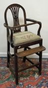 A 19th Century Hepplewhite design mahogany framed child's highchair with pierced back splat and