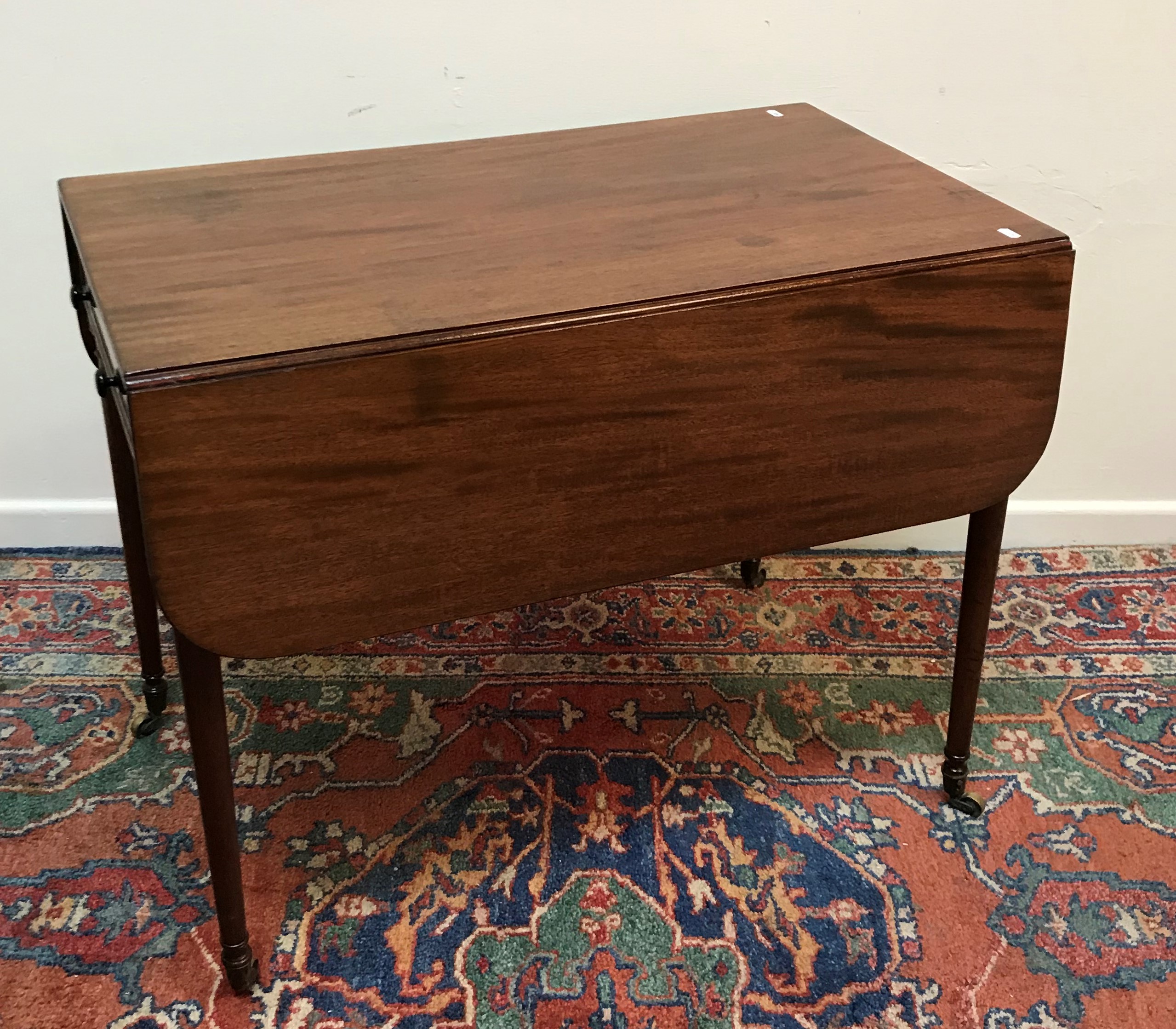 An early 19th Century mahogany Pembroke table,