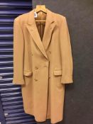 A ladies 100% cashmere double breasted camel coat by Herbie Frog of Jermyn Street with label