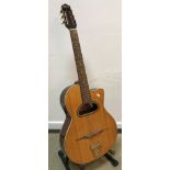 An Ozark Professional 3513 acoustic guitar with unusual opening