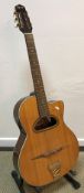 An Ozark Professional 3513 acoustic guitar with unusual opening