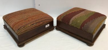 A pair of oak framed upholstered foot stools on squat bun feet 34 cm square x approx.