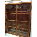 A pair of modern teak bookcase cabinets with sliding doors 150 cm wide x 50 cm deep x 190.