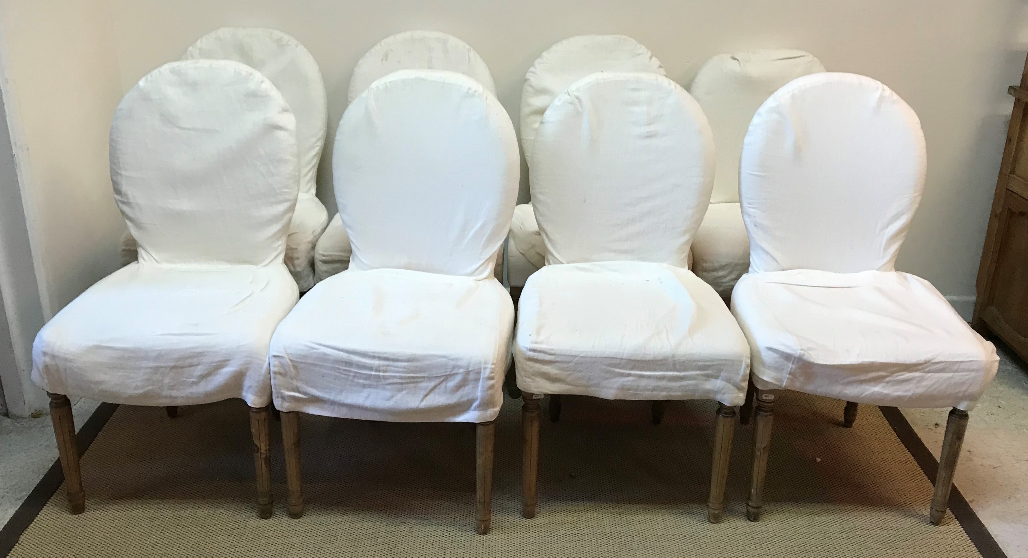 A set of eight OKA upholstered spoon back dining chairs on turned and fluted tapering legs to peg - Image 2 of 2