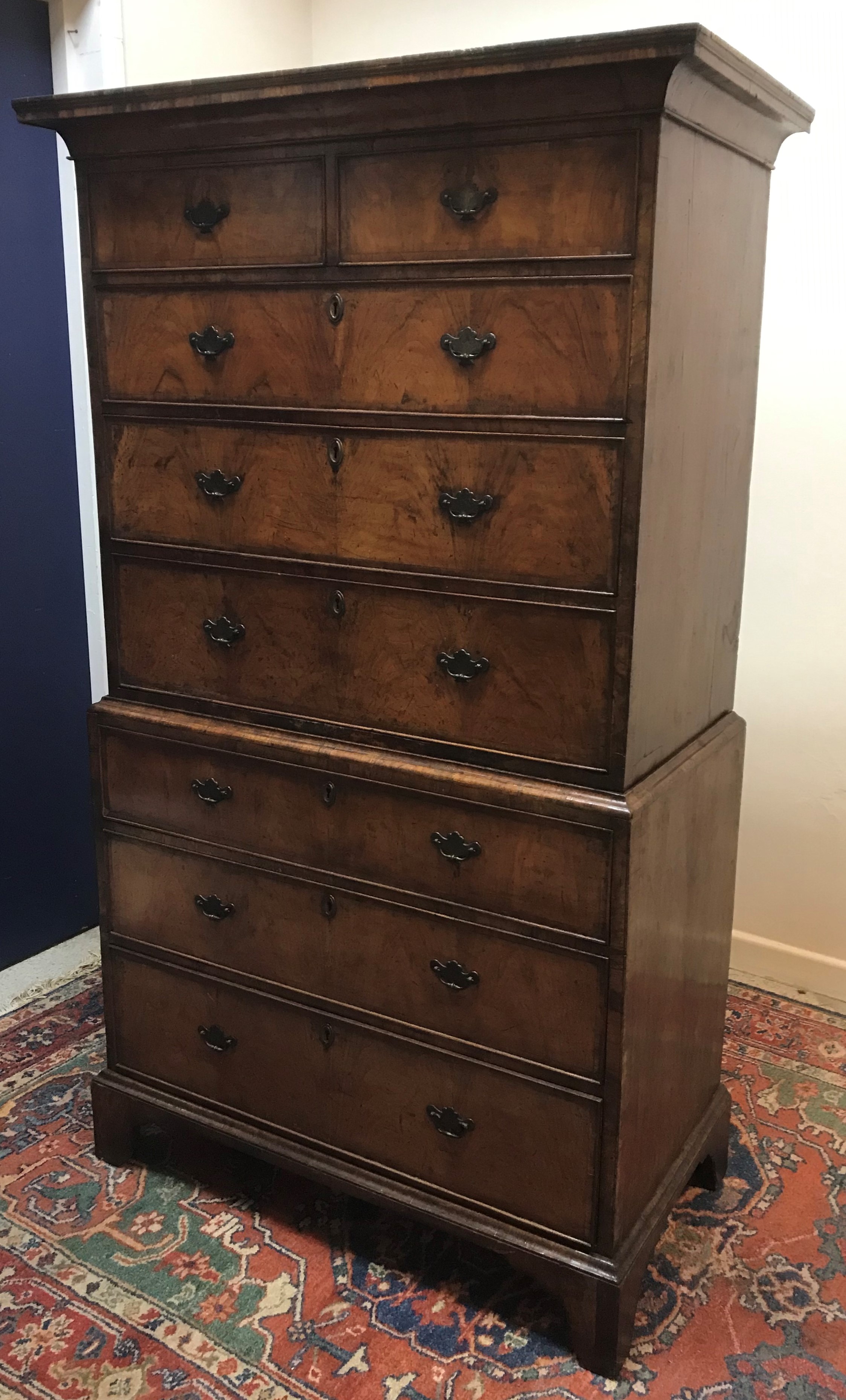 An 18th Century walnut and cross banded chest on chest,
