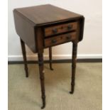 A Regency mahogany drop leaf Pembroke style work table with two drawers opposite two dummy drawers