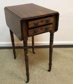 A Regency mahogany drop leaf Pembroke style work table with two drawers opposite two dummy drawers