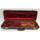 A 19th Century violin, the single piece maple back with ebony stringing,