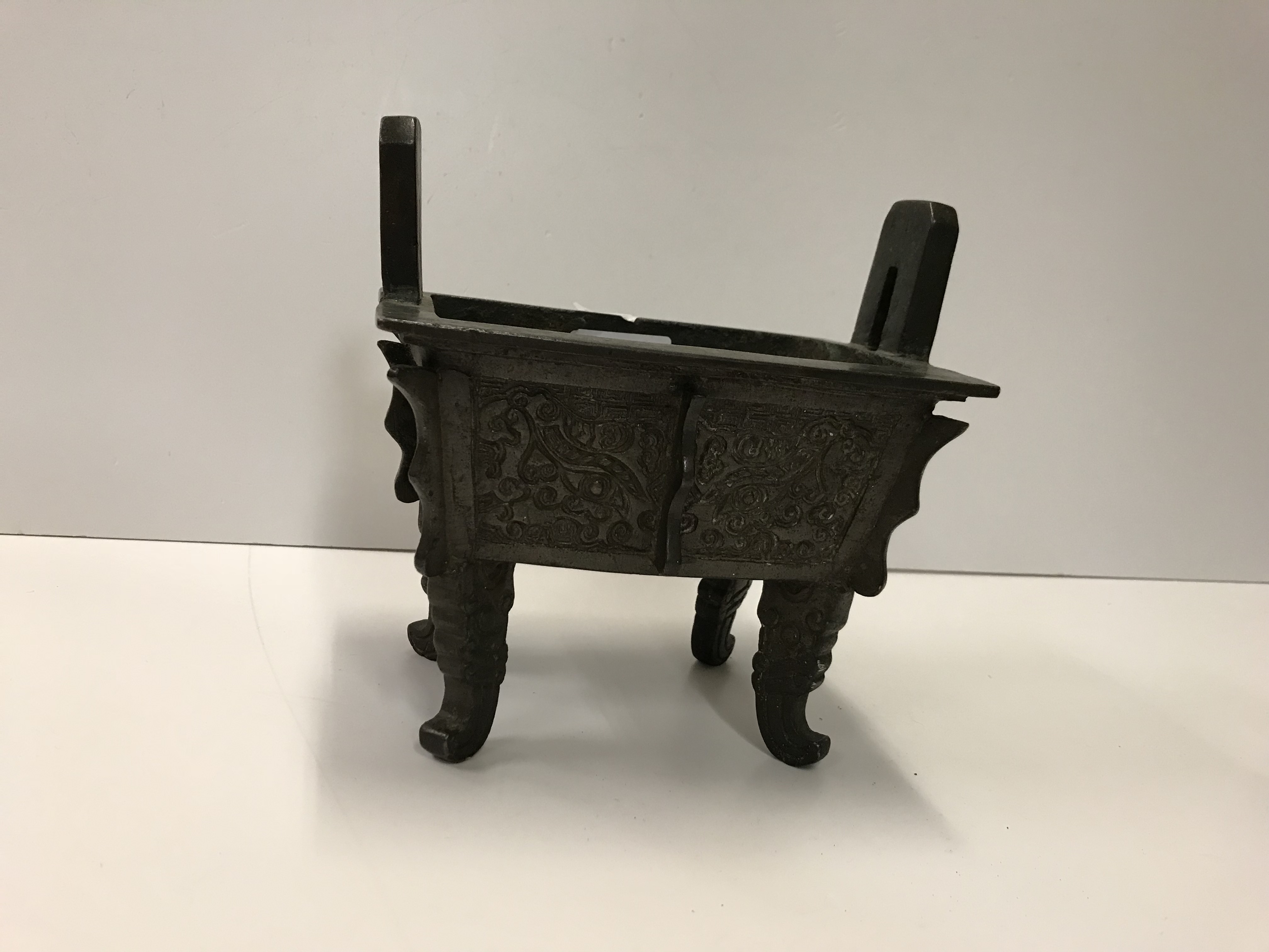 A Chinese bronze censer of rectangular form with relief work foliate decoration, - Image 9 of 19