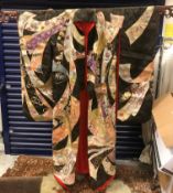 A 1920s wedding kimono with gold coloured wire embellishments and red silk lining