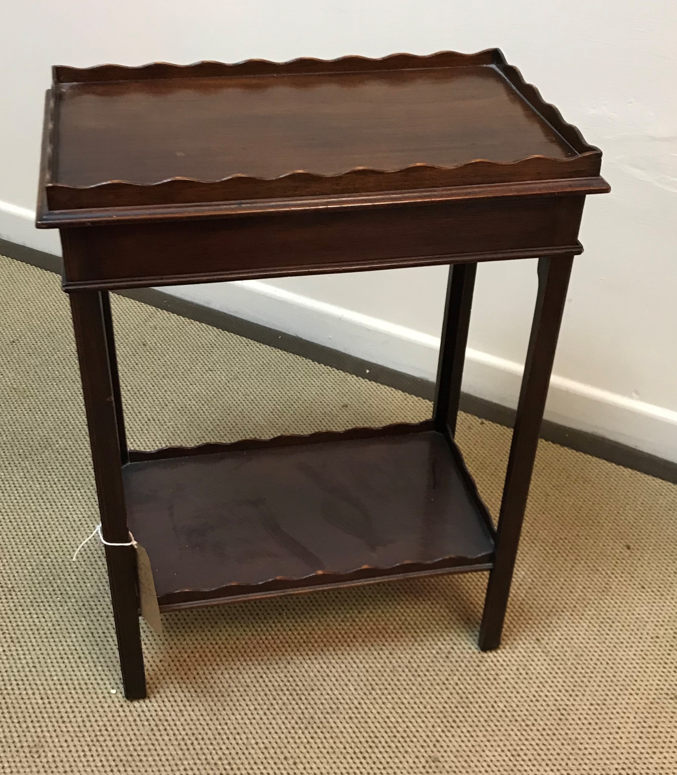 An early 20th Century mahogany two tier occasional table in the Georgian style,