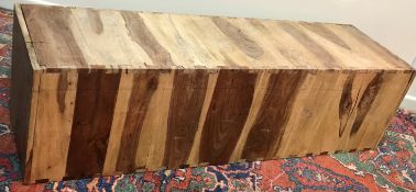 Three modern Indian hardwood box form benches or plinths, 40 cm x 41 cm x 143.