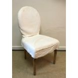 A set of eight OKA upholstered spoon back dining chairs on turned and fluted tapering legs to peg