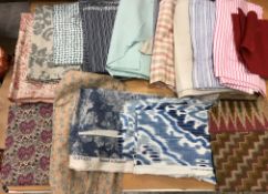 Two boxes of assorted textiles to include fabric remnants including Liberty, Zoffany etc,