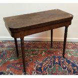 An early 19th Century mahogany foldover card table,