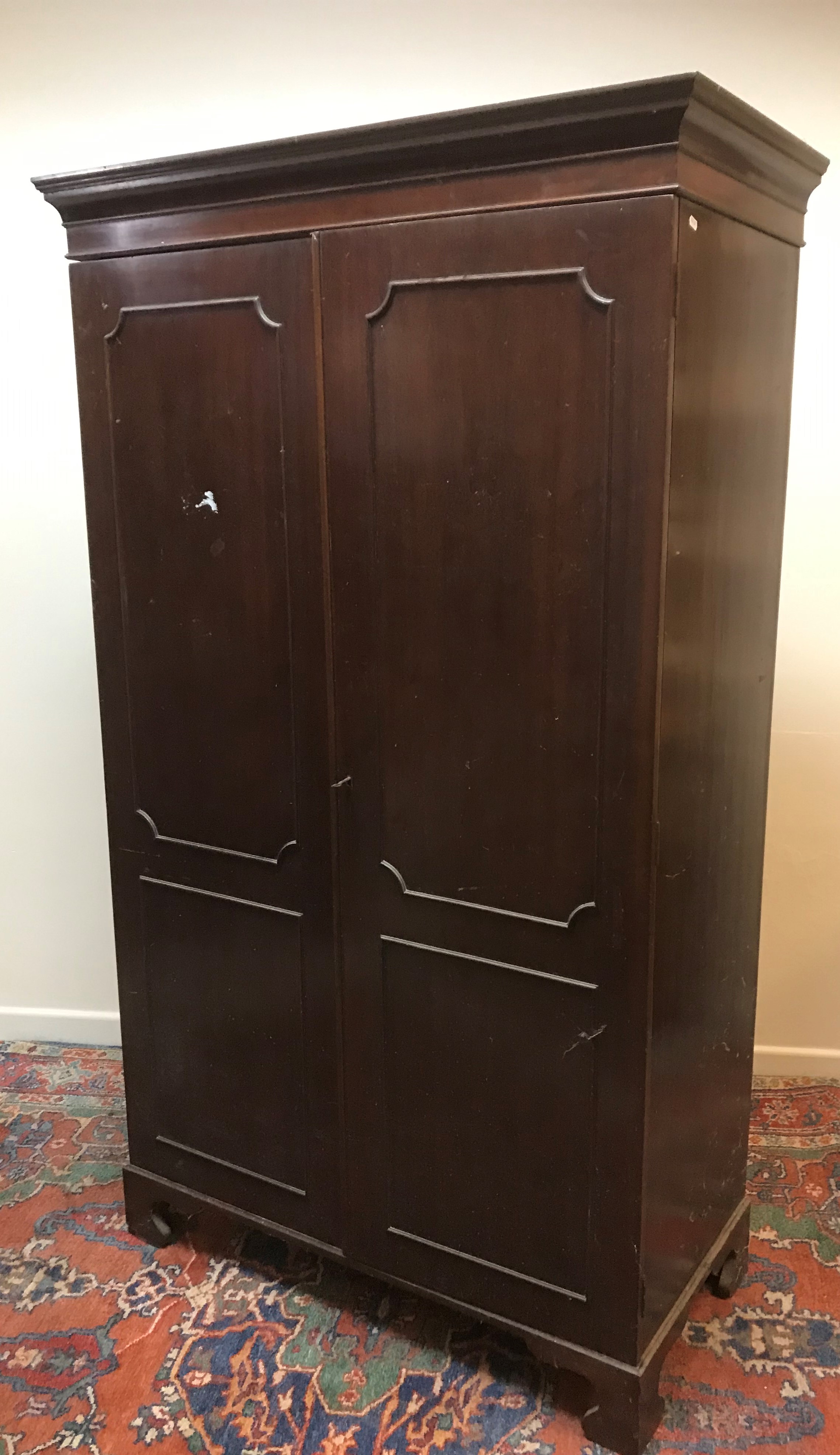 A mahogany two door wardrobe in the Georgian style with hanging space, raised on bracket feet, - Image 3 of 3