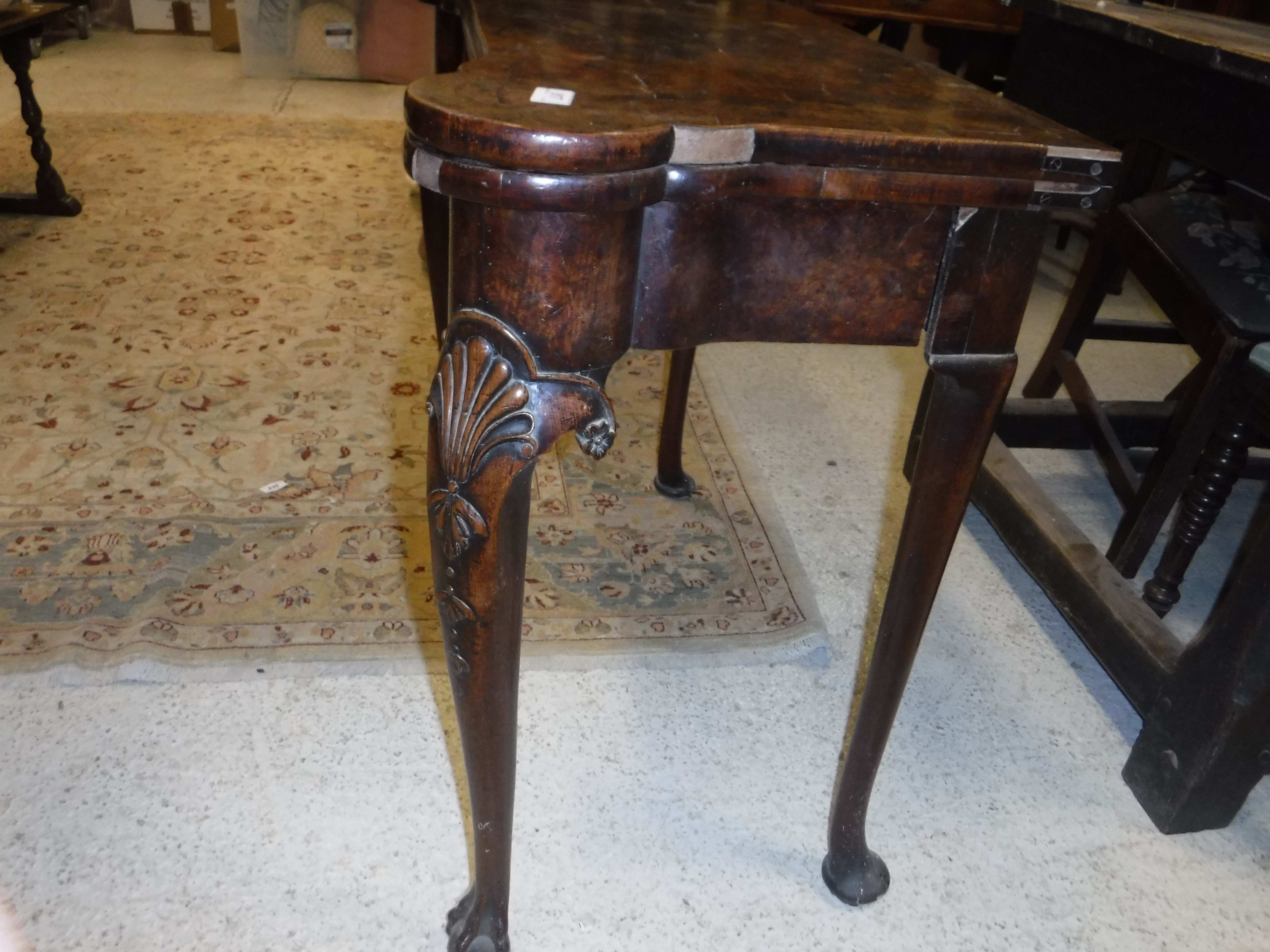 An 18th Century walnut veneered card table, the shaped top quartered, - Image 16 of 36