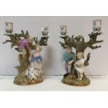 A pair of 19th Century Meissen figural candelabra "Egg collecting",