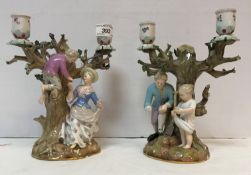 A pair of 19th Century Meissen figural candelabra "Egg collecting",